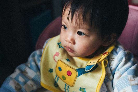 child with bib