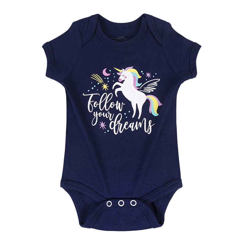 One-piece bodysuit with unicorn pattern and the text 'Follow Your Dreams' on the front.